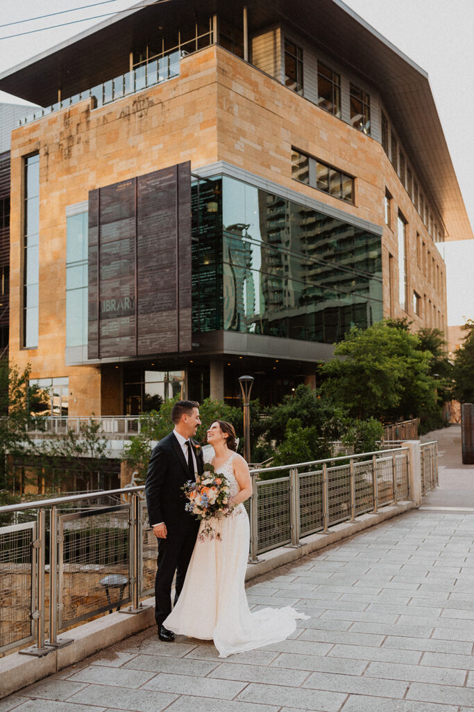 bride and groom outside Central Austin Public Library