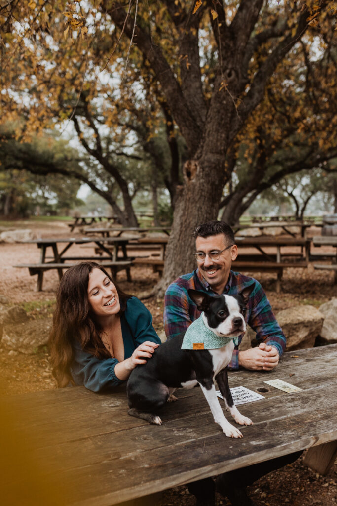 couple with their dog at Jester King engagement session
