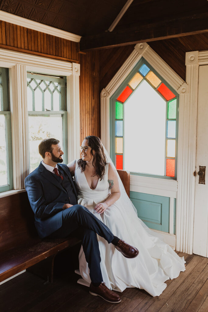 Couple sitting together inside Tiny T Ranch chapel