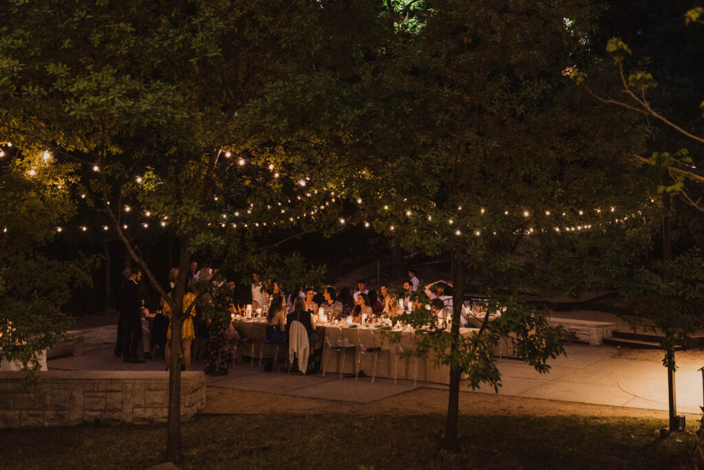 Guests dine during an intimate event at Umlauf Sculpture Garden in Austin, Texas
