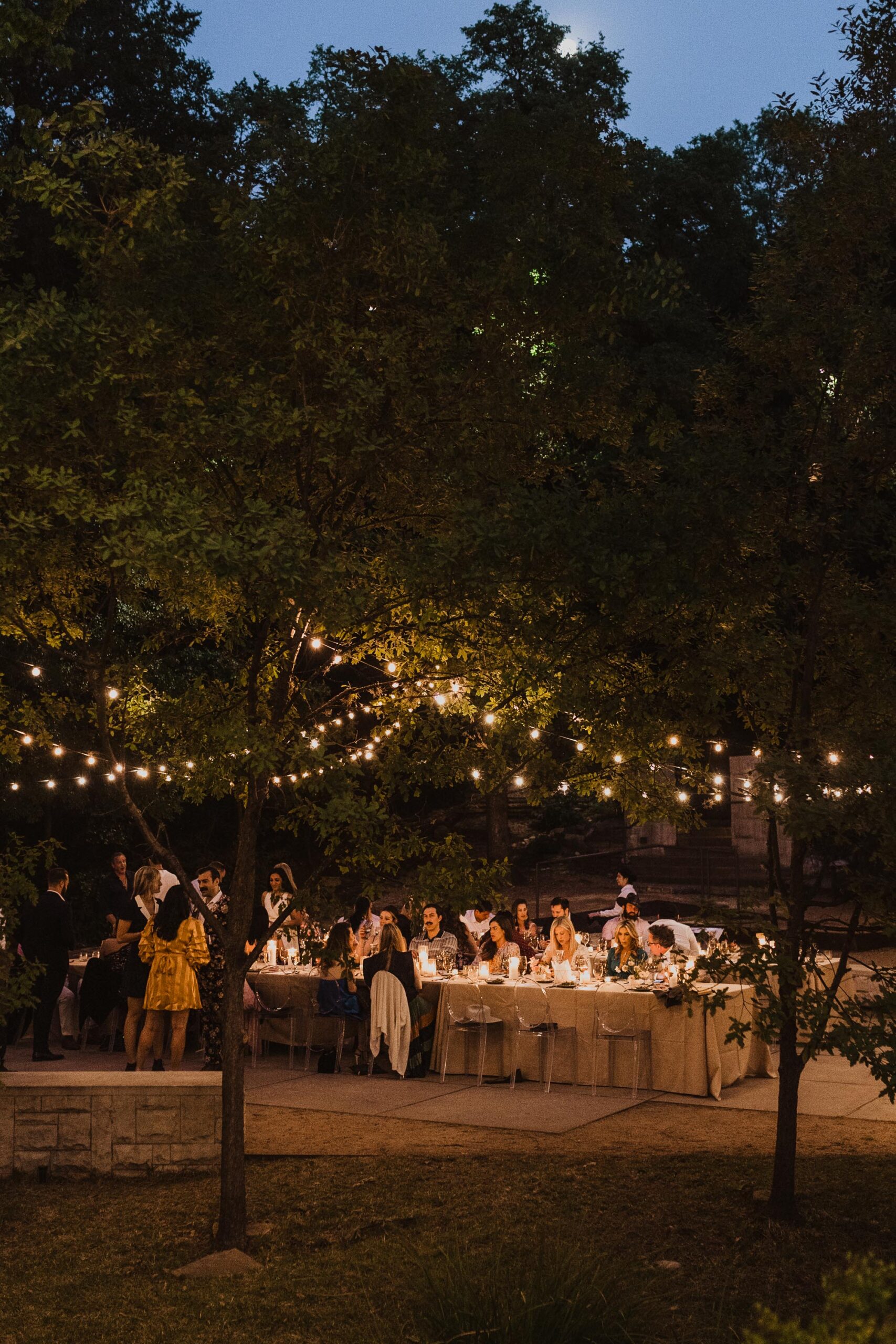 Guests dine during an intimate event at Umlauf Sculpture Garden in Austin, Texas