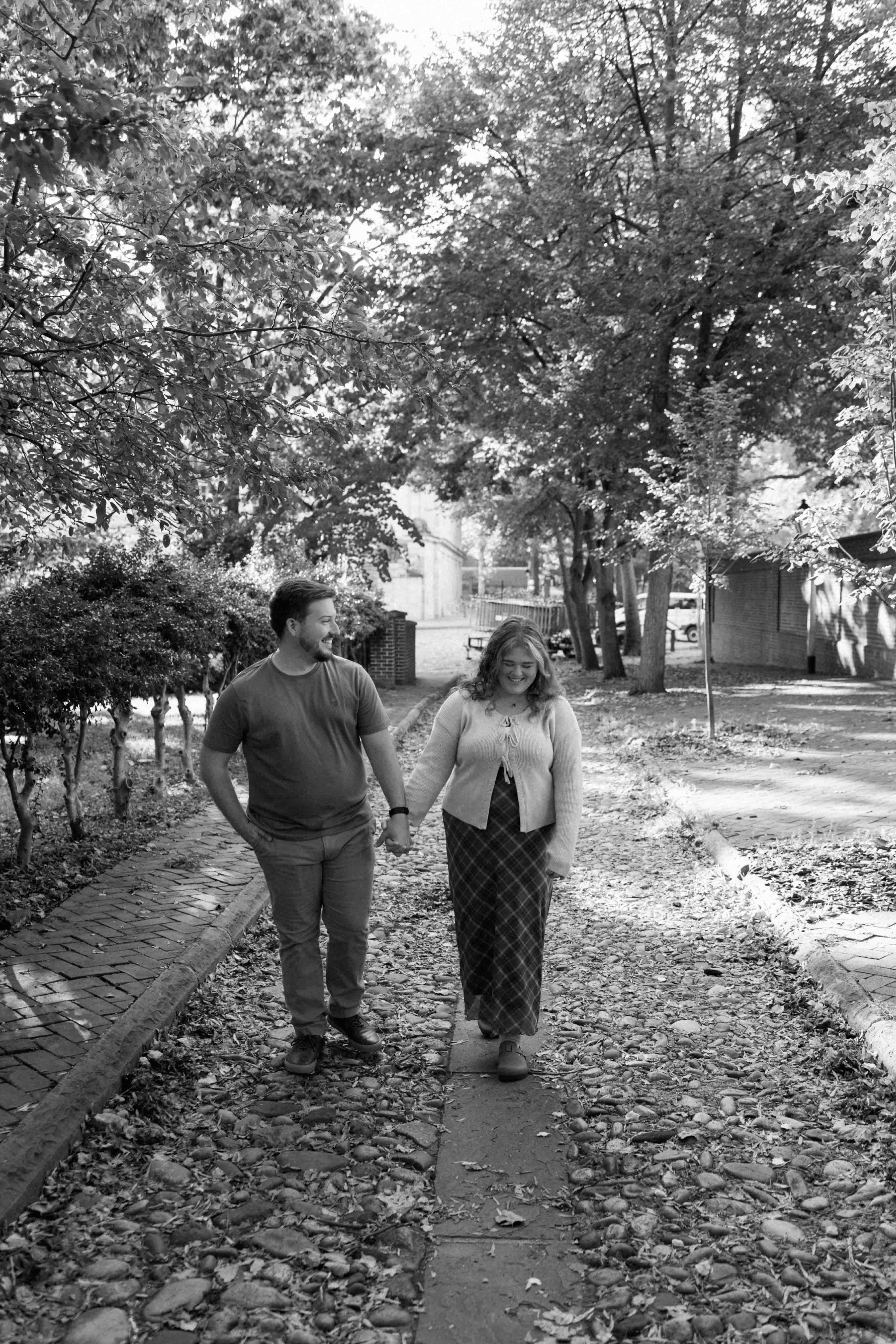 Couple poses for photos on historic cobblestone streets in Philadelphia