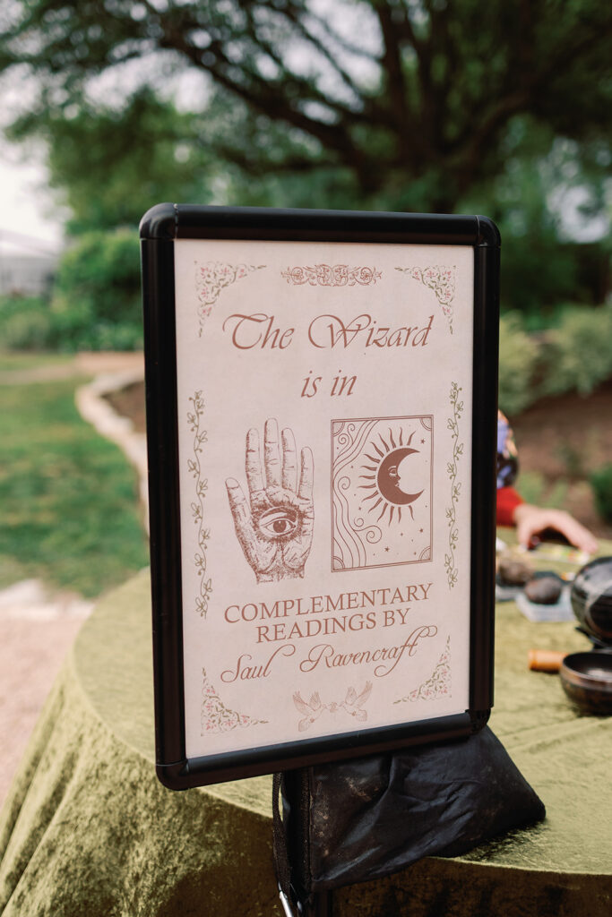 wizard doing tarot and palm readings at fantasy-inspired wedding