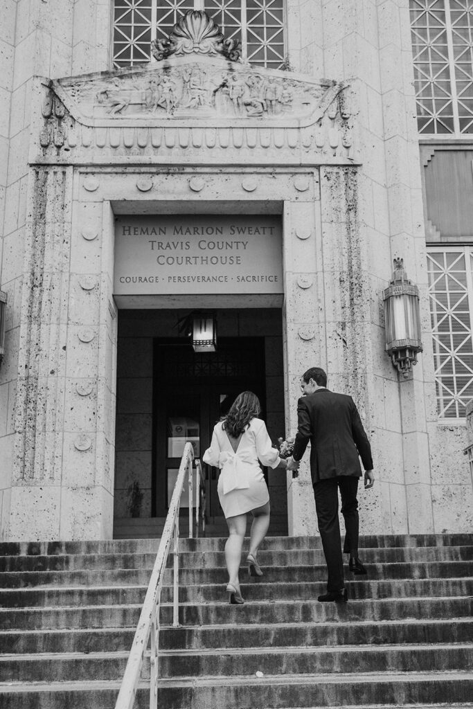 Couple arriving for Austin courthouse wedding ceremony