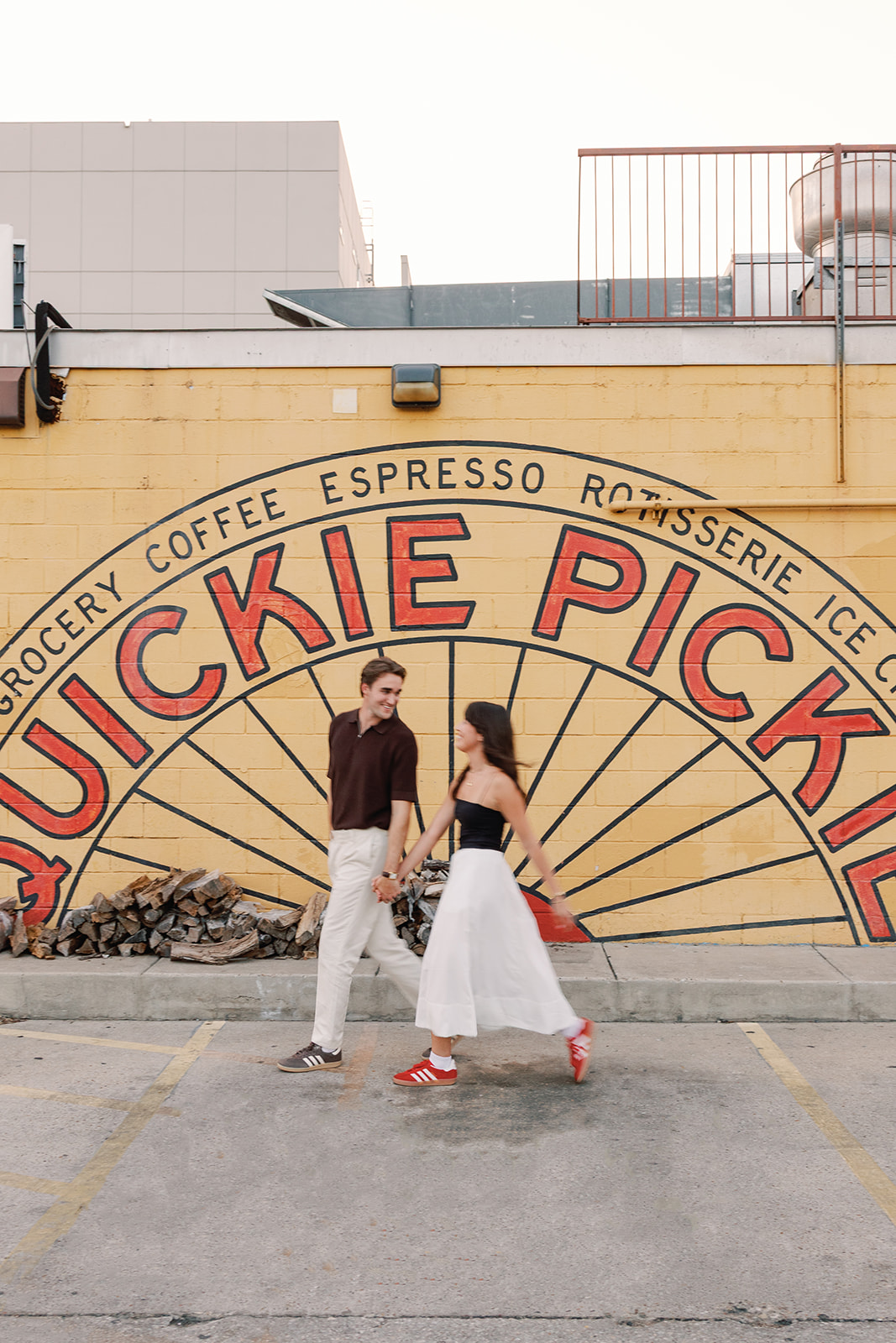 couple poses for an east austin engagement photo session